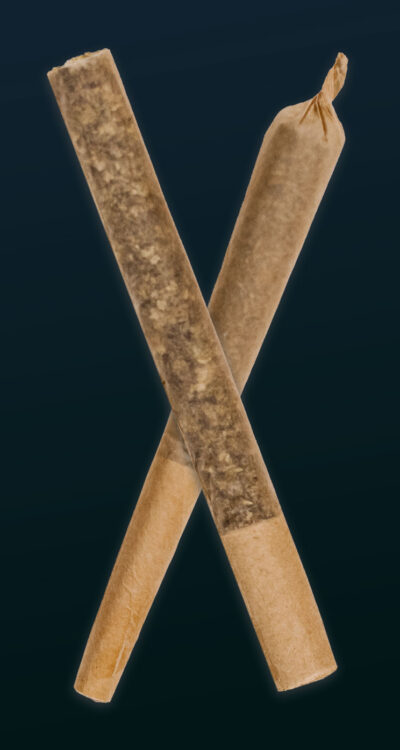 crossed cannabis joints one cone, one straight-roll