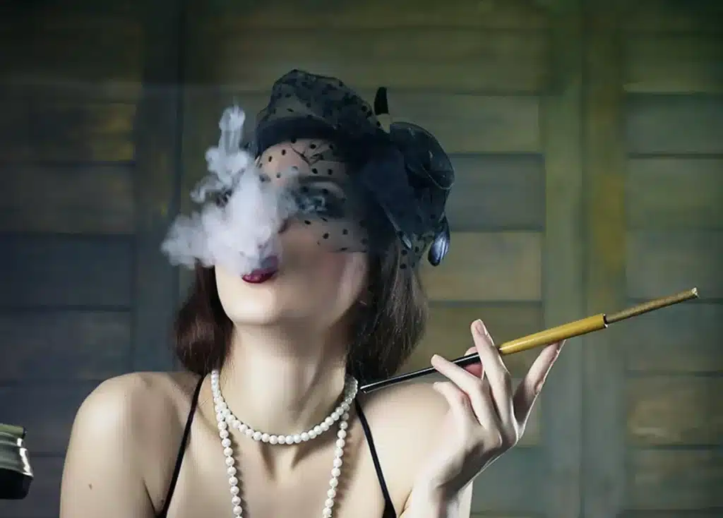 The History of Cannabis Culture in the USA: From Counterculture to Modern Lifestyle Woman smoking weed