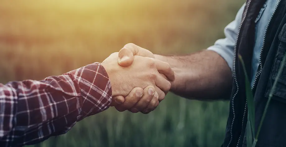 Customer Service Isn’t a Department, It’s Our Commitment at RollPros handshake between cannabis operator and technician