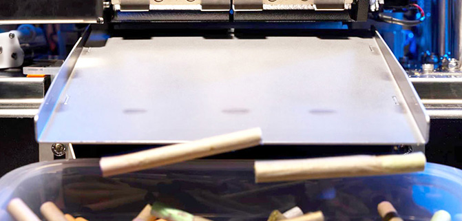 Enhancing Pre-roll Efficiency Tips for Optimizing Your Cannabis Workflow Automated pre-roll machine dispensing finished joints into a collection bin at a high-volume cannabis production facility.