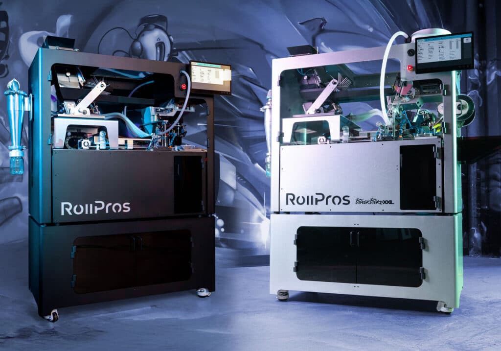 The Trophy Shelf Is Getting Crowded: RollPros Customers Keep Winning Two RollPros automated pre-roll machines, including the BlackBird XXL model, side-by-side in a sleek industrial setting with integrated digital control screens.