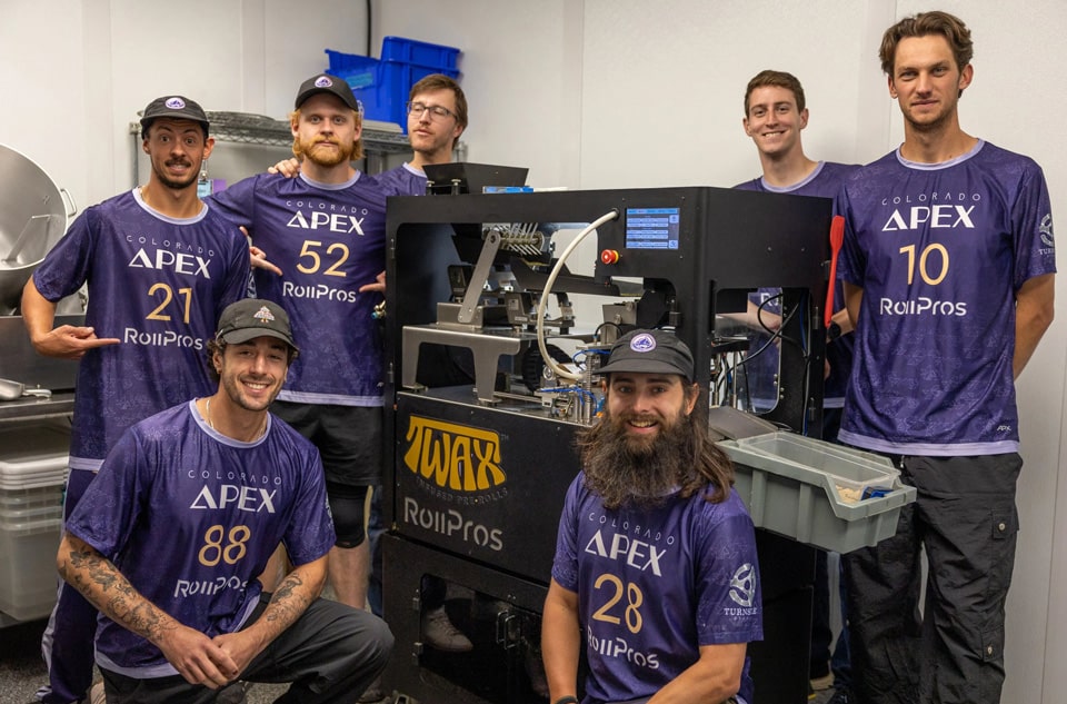 RollPros partners with Colorado Apex Professional Ultimate Frisbee Team RollPros Apex Team posing with the Clear BlackBird Joint Rolling Machine