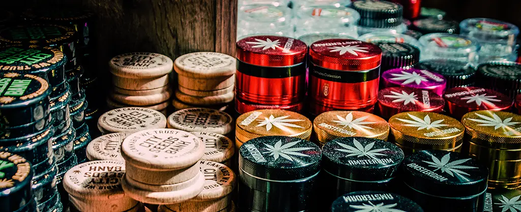 Best Accessories for Weed and Cannabis: Must-Have Gear for Modern Smokers Grinders Stacked Up different colors and materials wood, metal, and plastic