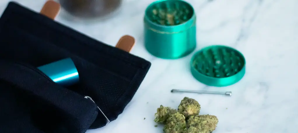 Best Accessories for Weed and Cannabis: Must-Have Gear for Modern Smokers Cannabis Products Grinder pouch and flower on a marble counter