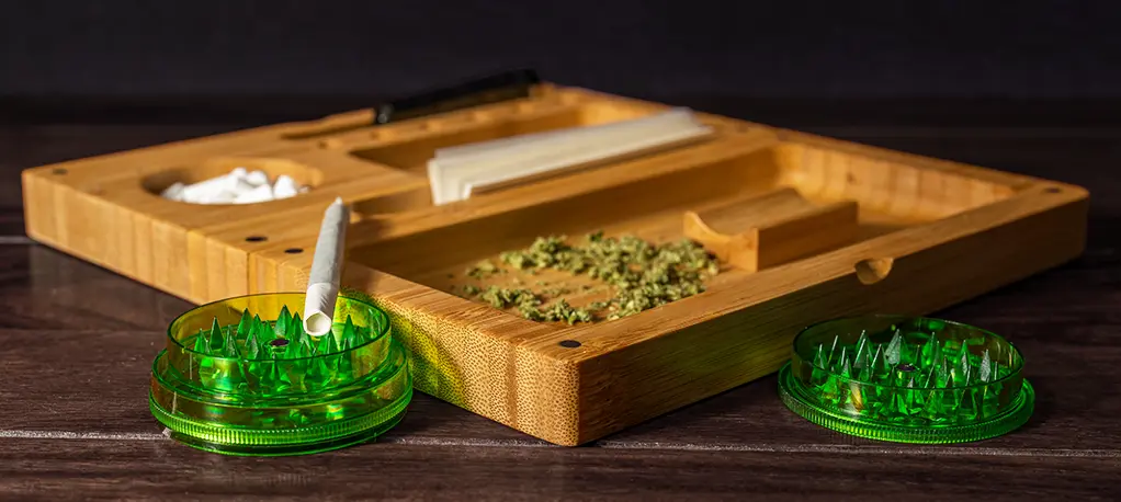 Best Accessories for Weed and Cannabis: Must-Have Gear for Modern Smokers Cannabis wooden tray with rolling papers flower grinder and pre-roll