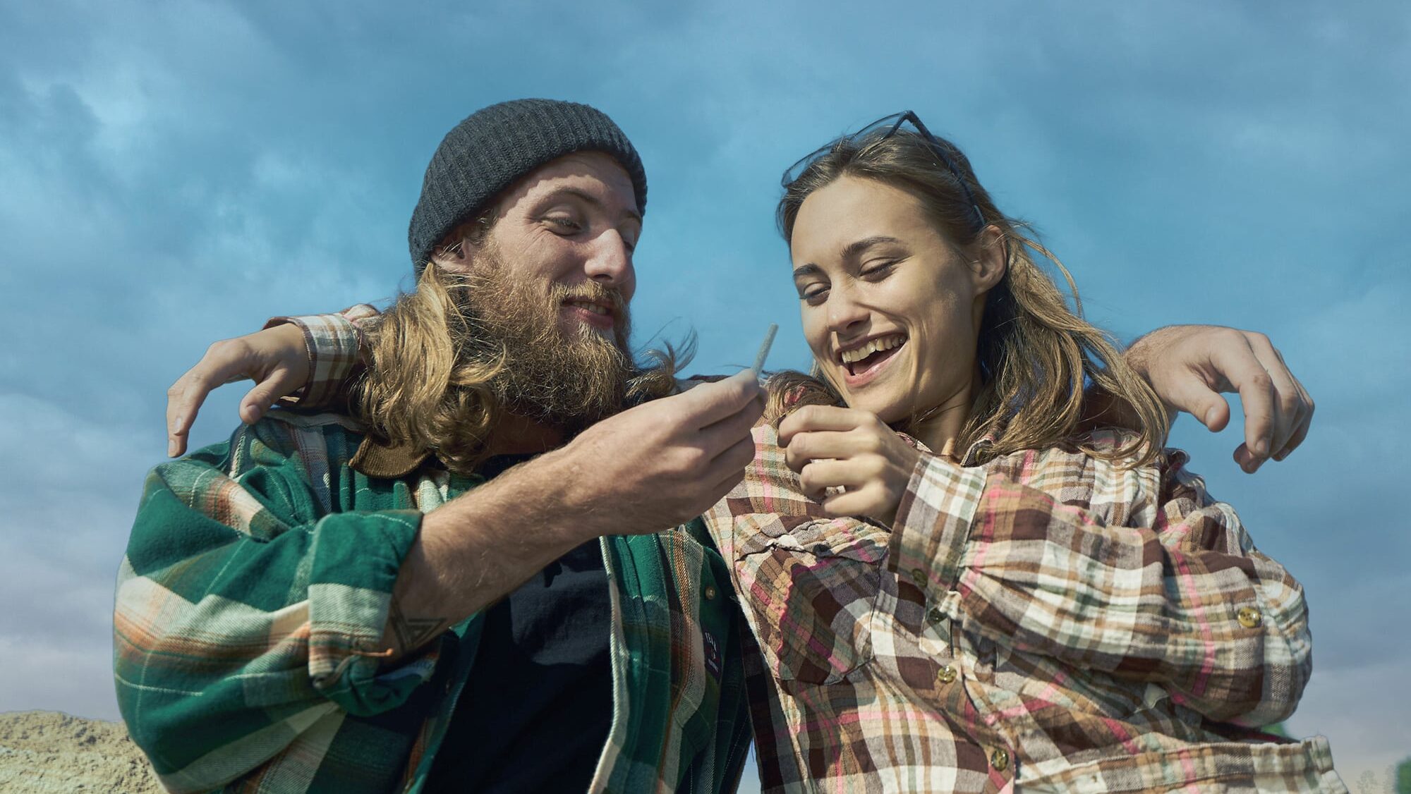 How Pre-Roll Quality Drives Customer Loyalty in Cannabis couple sharing a joint